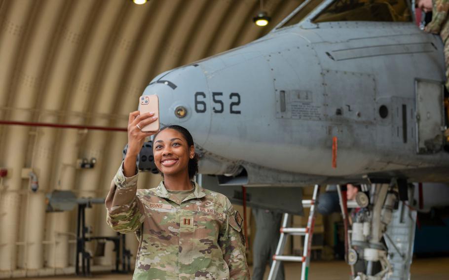 U.S. Air Force Capt. Kierra Goins, 51st Medical Group optometrist, takes a photo with an A-10 Thunderbolt II during Integrated Mustang 24-5 at Osan Air Base, Republic of Korea, Sept. 20, 2024.