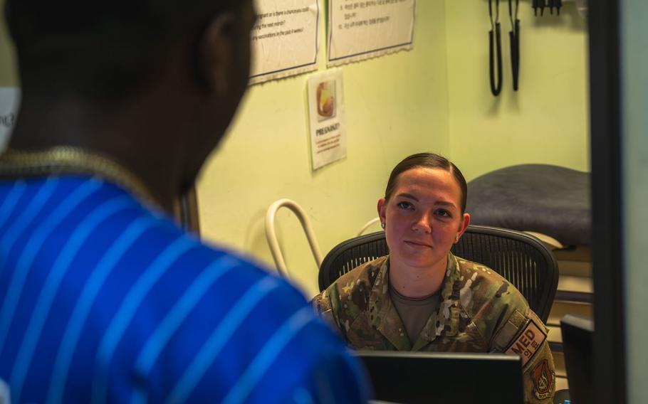 Senior Airman Emma Derosier, 8th Medical Group immunizations technician, speaks with a customer at Kunsan Air Base, Republic of Korea, Aug. 27, 2024.