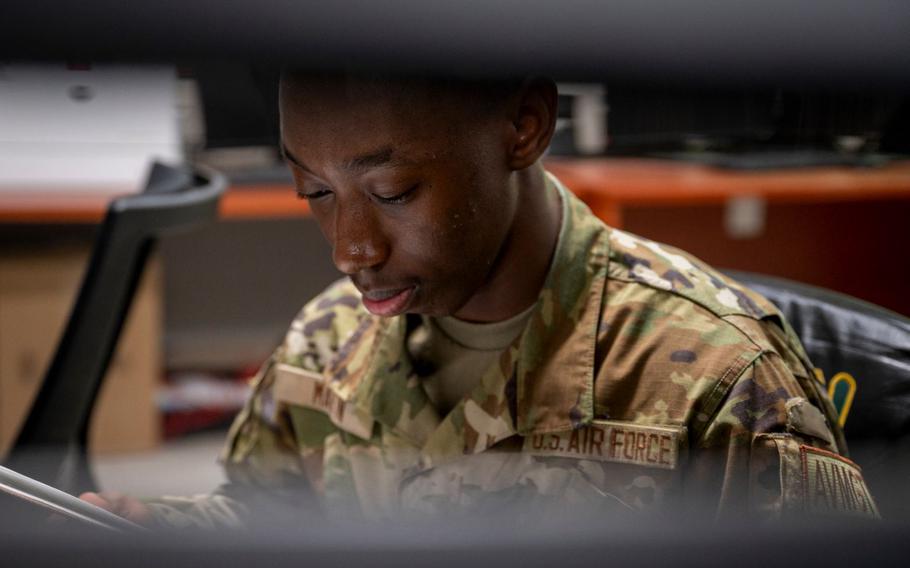 U.S. Air Force Airman 1st Class D’andrea Martin, 25th Fighter Squadron aviation resource manager, reviews a catalog at Osan Air Base, Republic of Korea, May 8, 2024.