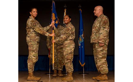 U.S. Air Force Lt. Col. Joy Spillers, middle, accepts command of the 51st Medical Support Squadron from Col. Mocha Robinson, left, 51st Medical Group commander, during a change of command ceremony at Osan Air Base, Republic of Korea, June 11, 2024.