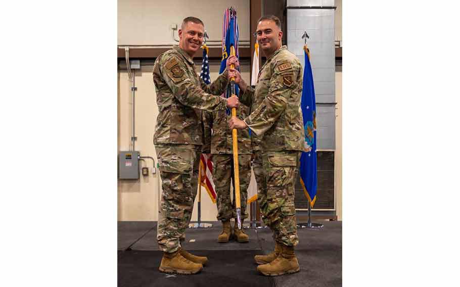 U.S. Air Force Lt. Col. Vincent McLean, right, relinquishes command of the 51st Logistics Readiness Squadron to Col. Kyle Grygo, left, 51st Mission Support Group commander, during a change of command ceremony at Osan Air Base, Republic of Korea, June 14, 2024.