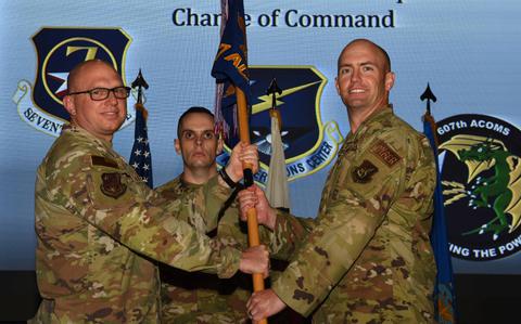 Photo Of U.S. Air Force Lt. Col. Matthew Babcock, right, accepts command of the 607th Air Communications Squadron from Col. Daniel Biehl, 7th Air Operations Center deputy commander, during a change of command ceremony at Osan Air Base, Republic of Korea, July 19, 2024.