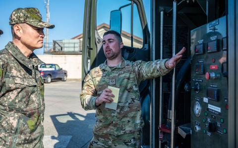 Photo Of U.S. Air Force Senior Airman Nicholas Dire’, 51st Logistics Readiness Squadron fuels equipment maintenance technician, explains fuel truck operations to Republic of Korea Army Brig. Gen. Jung Hwan Lee, Combined Forces Command C4 director at Osan Air Base, ROK.