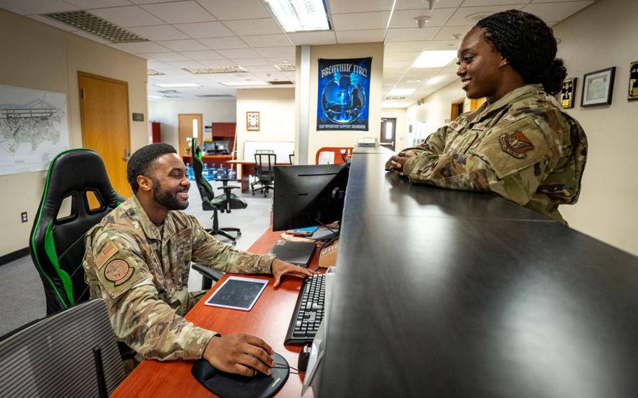 U.S. Air Force Senior Airman Calvin Wright, airfield management operations supervisor, 51st Operational Support Squadron, speaks with a teammate while coordinating scheduled runway checks for foreign object debris at Osan Air Base, Republic of Korea.