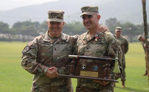 Photo Of Maj. Gen. Charles Lombardo, commanding general of the 2nd Infantry Division/ROK-U.S. Combined Division and Col. Christopher S. Nunn, Commander of 1st Stryker Brigade Combat Team are pictured during a Transfer of Authority ceremony, on Camp Casey, South Korea