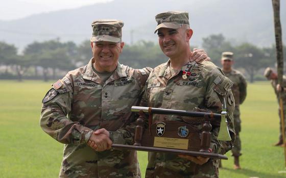Maj. Gen. Charles Lombardo, commanding general of the 2nd Infantry Division/ROK-U.S. Combined Division and Col. Christopher S. Nunn, Commander of 1st Stryker Brigade Combat Team are pictured during a Transfer of Authority ceremony, on Camp Casey, South Korea