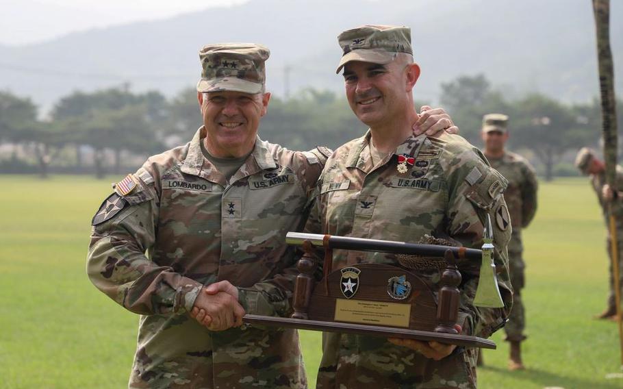 Combined Division and Col. Christopher S. Nunn, Commander of 1st Stryker Brigade Combat Team are pictured during a Transfer of Authority ceremony.