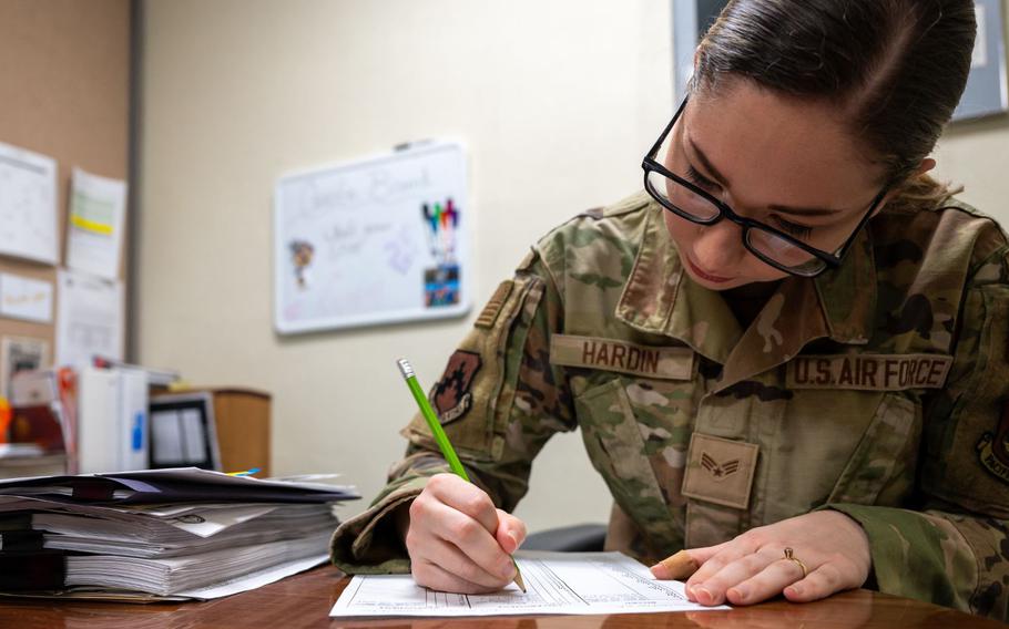 Senior Airman Erin Hardin, 8th Fighter Wing paralegal, prepares legal documents at Kunsan Air Base, Republic of Korea, Feb. 29, 2024.