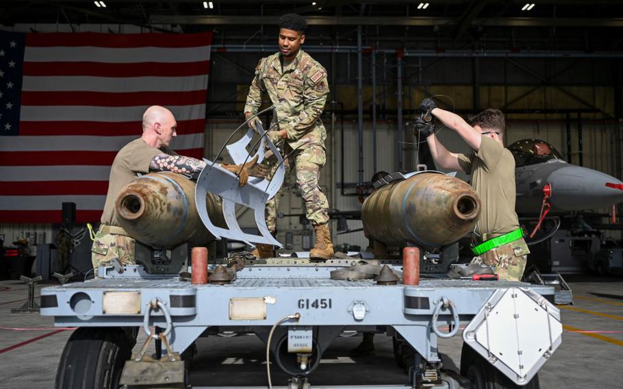 Airmen prepare munitions for loading during the 2024 3rd Quarter Dedicated Crew Chief and Load Crew Competition at Kunsan Air Base.