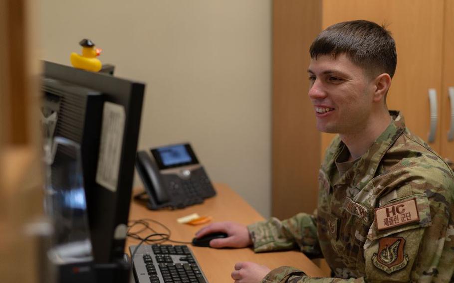 Staff Sgt. Peter Southworth, 8th Fighter Wing chapel, NCO in charge of chapel readiness, reviews electronic notifications after visiting Airmen across the installation at Kunsan Air Base, Republic of Korea, Jan. 11, 2024. Southworth was chosen to brief an audience of 108 U.S. Soldiers, Sailors, Airmen and ROK military personnel on chemical, biological, radiological and nuclear response procedures, fostering a culture of readiness. (U.S. Air Force photo by Senior Airman Karla Parra)