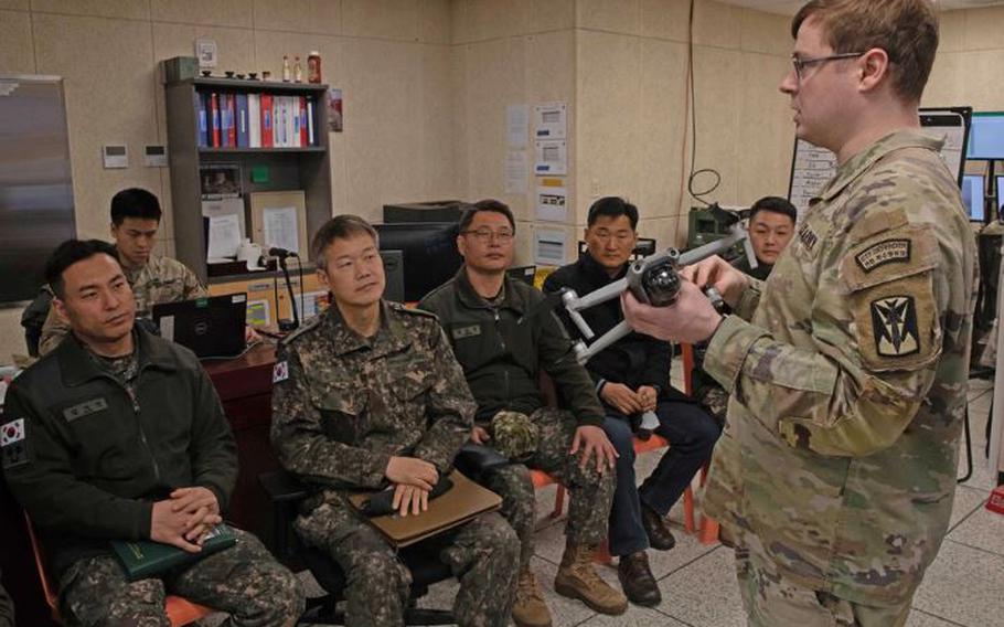 Capt. Johnathan Klier, 35th Air Defense Artillery Brigade protection officer, holds a small unmanned aerial system, commonly referred to as a drone, when discussing counter-small UAS training with Republic of Korea Army Soldiers earlier this year. In recent months, Eighth Army has teamed up with the Republic of Korea Army in a series of training exercises to counter this emerging threat by having their counter-small UAS teams conduct joint training. (U.S. Army photo by 55th Signal Company)