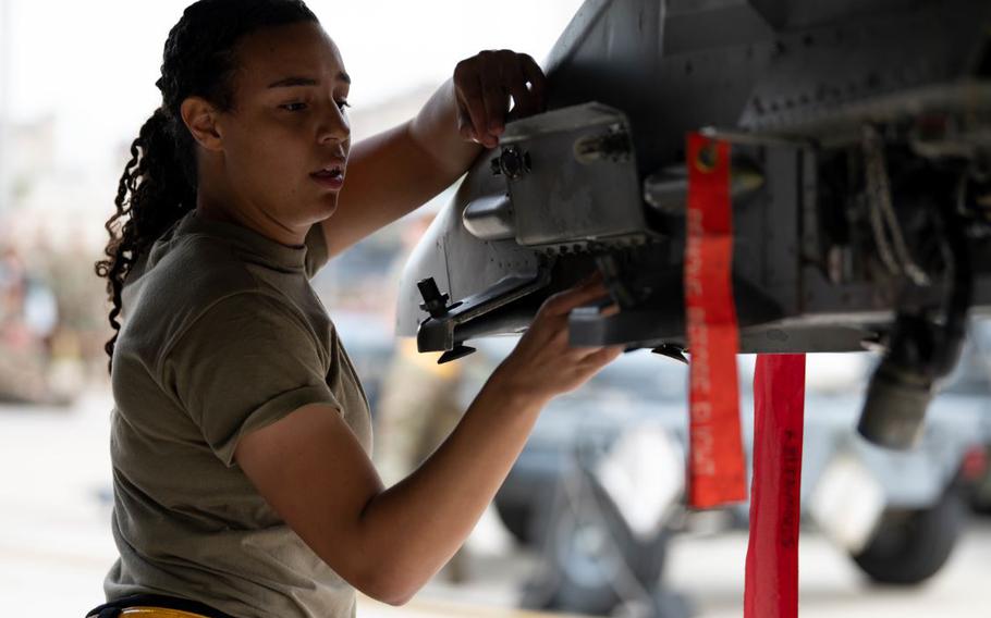 Airman 1st Class Cameron Price, 80th Fighter Generation Squadron weapons load crew member prepares a F-16 Fighting Falcon for munitions loading during the 3rd Quarter Load Crew Competition at Kunsan Air Base, Republic of Korea, Oct. 21, 2022. Teams were evaluated on safety, reliability and technical proficiency throughout the competition. (U.S. Air Force photo by Senior Airman Shannon Braaten)