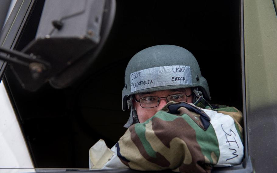 U.S. Air Force Staff Sgt. Erick Plascencia, 51st Civil Engineering Squadron electrical power production journeyman, looks out of a work truck during Vigilant Storm 23 at Osan Air Base, Republic of Korea, Nov. 1, 2022. VS23 is an annually recurring, re-planned training that provides Airmen the ability to test their proficiency and readiness to perform tasks in an emergency environment. (U.S. Air Force photo by Staff Sgt. Dwane R. Young)