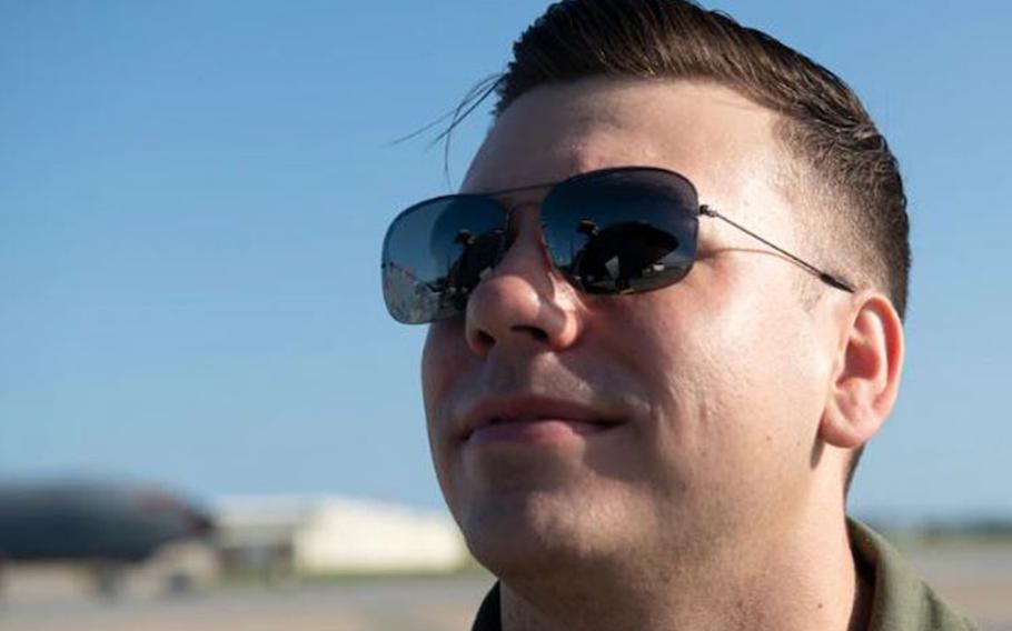 U.S. Air Force Capt. Shelby Clark, 909th Air Refueling Squadron pilot, inspects a KC-135 Stratotanker on Kadena Air Base, Japan, Oct. 15, 2021. Clark was the primary aerial refueling tanker coordinator for a Combat Search and Rescue Training event. The training focused on maximizing integration while taking advantage of the unique opportunity presented to practice Personnel Recovery across the Pacific Region. (U.S. Air Force photo by Senior Airman Jessi Monte