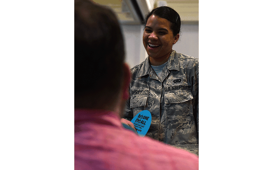 U.S. Air Force Senior Airman Alyssa Duprey, American Forces Network Kunsan broadcaster, speaks with John Crawford, 8th Force Support Squadron librarian, during the Airmen 4 Airmen Club Fair during the Resilience Tactical Pause capstone event at Kunsan Air Base, Republic of Korea, Sept. 13, 2019. The event featured clubs for individuals looking to volunteer, develop professionally and join social organizations. (U.S. Air Force photo by Staff Sgt. Joshua Edwards)