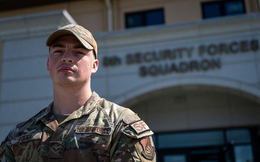 Senior Airman Ryan Foley, 8th Security Forces Squadron reports and analysis clerk, stands outside of the 8th SFS headquarters building at Kunsan Air Base, Republic of Korea, Oct. 5, 2023. While filling the non-commissioned officer in charge responsibilities, Foley coordinated the reports and analysis section priorities with squadron leaders, investigators, and first sergeants across Kunsan AB. (U.S. Air Force photo by Staff Sgt. Jovan Banks)