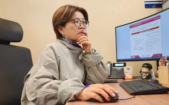 Photo Of Ms. Song Yon-Chong works on her Defense Acquisition University training course on Aug. 20, 2024, in her new office at Headquarters Navy Region Korea.