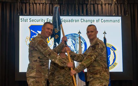 Photo Of U.S. Air Force Lt. Col. Daniel Evans, right, accepts command of the 51st Security Forces Squadron from Col. Kyle Grygo, 51st Mission Support Group commander, during a change of command ceremony at Osan Air Base, Republic of Korea, June 12, 2024.