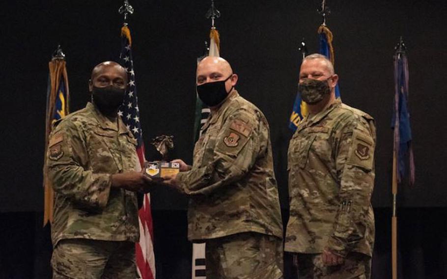 Staff Sgt. Andrew Huberty, 51st Wing Staff Agency, accepts the 51st Fighter Wing Volunteer of the Quarter Award on Osan Air Base, Republic of Korea, April 30, 2021. (U.S. Air Force photo by Staff Sgt. Douglas Lorance)