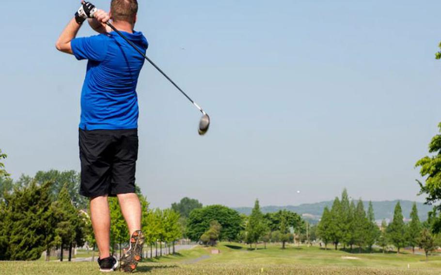 Tech. Sgt. Zachary Ibach, 51st Security Forces Squadron flight sergeant, tees off during the Police Week Golf Tournament at Osan Air Base, Republic of Korea, May 13, 2021. Teams of up to four participants competed across 18 holes to determine a winner. (U.S. Air Force photo by Staff Sgt. Douglas Lorance)