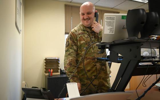 Photo Of U.S. Air Force Tech. Sgt. Aaron Jennings, 8th Operations Support Squadron noncommissioned officer in charge of current operations flight, coordinates scheduling on the phone at Kunsan Air Base, Republic of Korea, Aug. 13, 2024.