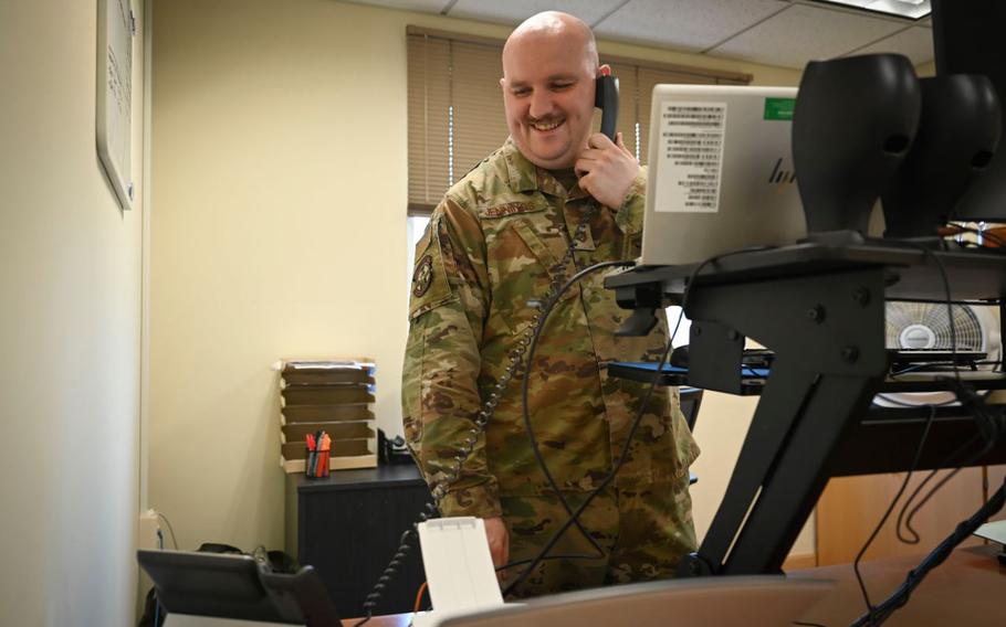 U.S. Air Force Tech. Sgt. Aaron Jennings, 8th Operations Support Squadron noncommissioned officer in charge of current operations flight, coordinates scheduling on the phone at Kunsan Air Base, Republic of Korea, Aug. 13, 2024.