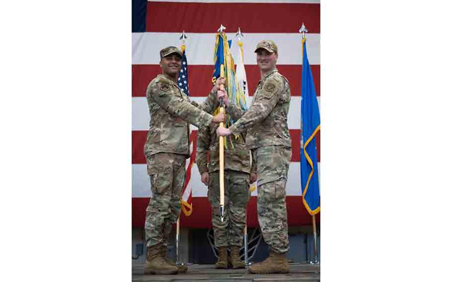 U.S. Air Force Joshua Hawkins, 8th Mission Support Group commander, passes command to Maj. Stephen Perkins, 8th Communications Squadron incoming commander, during a change of command ceremony at Kunsan Air Base, Republic of Korea.