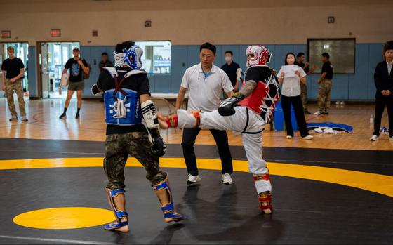 U.S. Army Capt. Davon Stuart, right, 524th Military Intelligence Battalion officer in charge, lands a kick during the 2025 ROK-US Combat Taekwondo Exhibition.