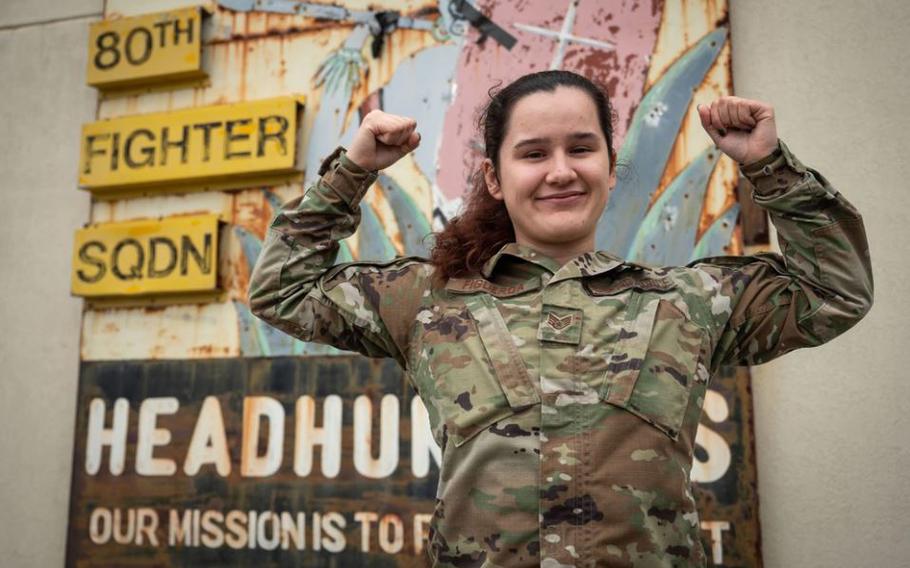 Staff Sgt. Margarita Figueroa, 80th Fighter Squadron non-commissioned officer in charge of intelligence operations, motions the “crush ‘em” unit gesture at Kunsan Air Base, Republic of Korea, May 21, 2024. 