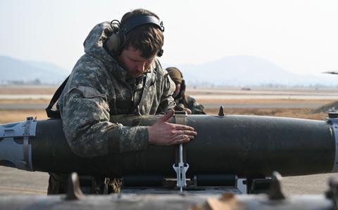 Photo Of Staff Sgt. Gary Beam, 35th Fighter Generation Squadron aircraft armament systems load crew team chief, unloads a munition during Exercise Beverly Pack 25-1 .