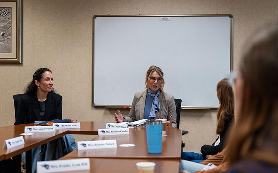 Dr. Doniel Wolfe, left, spouse of Chief Master Sgt. David R. Wolfe, Pacific Air Forces command chief, and Cindy Wilsbach, spouse of Gen. Ken Wilsbach, PACAF commander, share insights during their discussion with non-command sponsored spouses at Kunsan Air Base, Republic of Korea, Oct. 20, 2023. Wilsbach and Wolfe took the opportunity to discuss the challenges military families face when separated during short tours. (U.S. Air Force photo by Staff Sgt. Samuel Earick)