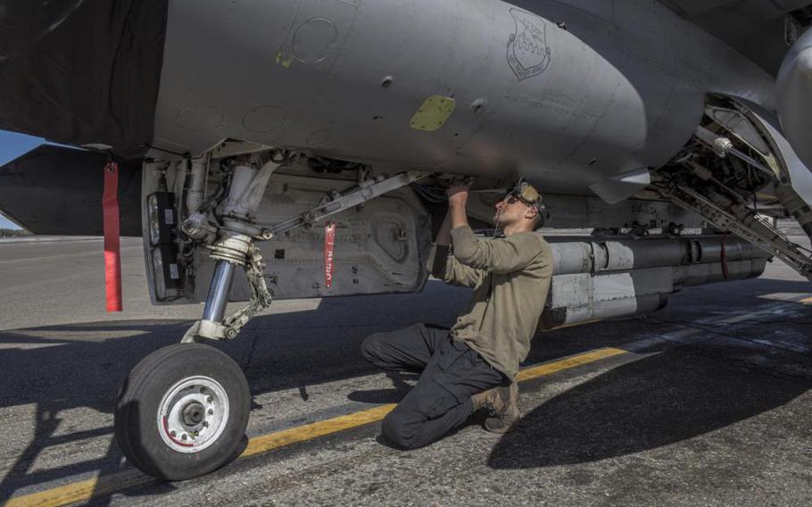 Senior Airman Zakeria Qasemi, 36th Fighter Generation Squadron, crew chief, preforms post flight maintenance on an F-16 Fighting Falcon during RED FLAG-Alaska 22-1 at Eielson Air Force Base, Alaska, May 4, 2022. The 36th FS and newly activated 36th FGS work together to prepare for and execute missions in defense of the Republic of Korea and regional stability. (U.S. Air Force photo Senior Airman Megan Estrada)