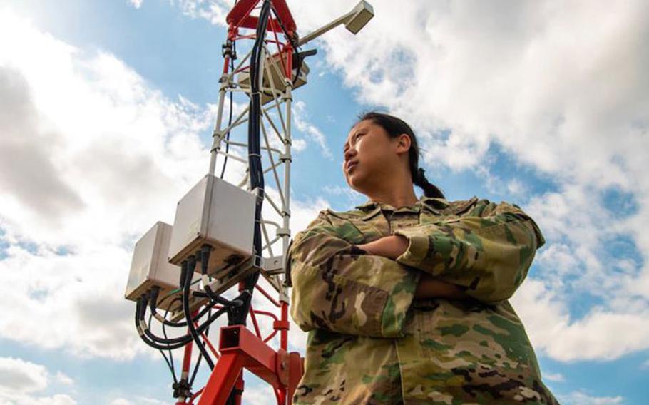 Tech. Sgt. Isabelle Qi, 51st Operations Support Squadron airfield services element non-commissioned officer-in-charge, glances across the airfield at Osan Air Base, Republic of Korea, Oct. 13, 2021. The weather flight provides flight and area weather forecasts for more than 10,000 F-16, A-10, U-2 and transient sorties per year and issues resource protection alerts for approximately $3.4 billion worth of combat-ready assets and 7,200 base personnel. OSW manages $462,000 of fixed and deployable meteorological