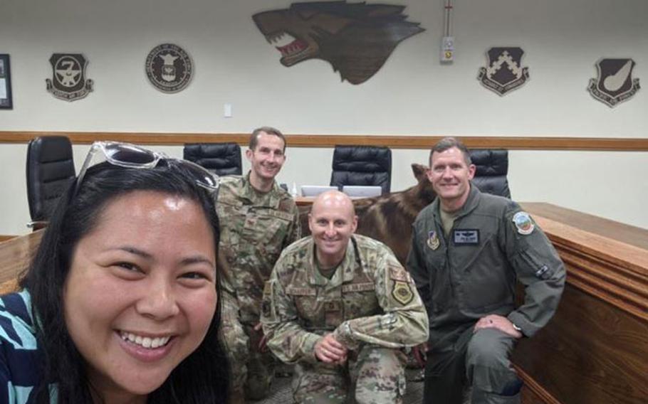 Ricah Quinto, 8th Force Support Squadron Community Cohesion Coordinator, smiles with 8th Fighter Wing leadership at Kunsan Air Base, Republic of Korea, July 2021. Cohesion Coordinators are responsible for revitalizing squadrons by providing unit commanders with the flexibility to develop dynamic and innovative programs that build unit cohesion for our Airmen.​​ (Courtesy photo)