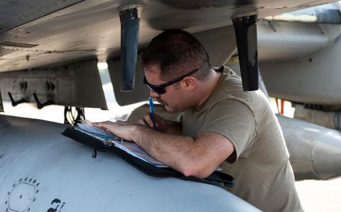 Photo Of U.S. Air Force Staff Sgt. Charles Durnin, 25th Fighter Generation Squadron crew chief, goes over an A-10 Thunderbolt II checklist at Clark Air Base, Philippines