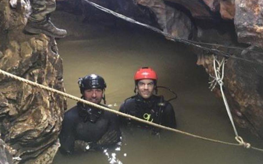 Courtesy photo from U.S. Air Force pararescueman, Tech Sgt Jamie Brisbin (right, red helmet) of the 106th Rescue Wing's 103rd Rescue Squadron who took part as a diver in the 2018 Thai Cave rescue pictured here with Tech. Sgt. John Merchand.