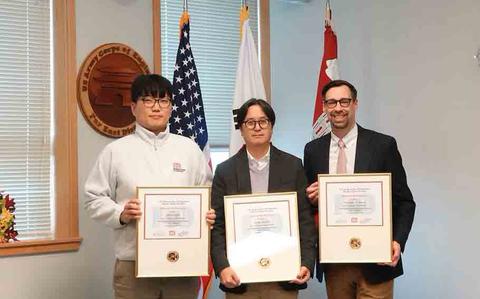 Photo Of Sang Na, Civil Engineer, U.S. Army Corps of Engineers – Far East District, accepts Minjae “MJ” Park’s certificate on his behalf; while Seung Ji, Deputy Chief of Construction; and Christopher Carson, project manager, accepts their completion certifications at the USACE Leadership Development Program (ULDP) Level 3 graduation.