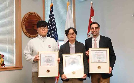 Sang Na, Civil Engineer, U.S. Army Corps of Engineers – Far East District, accepts Minjae “MJ” Park’s certificate on his behalf; while Seung Ji, Deputy Chief of Construction; and Christopher Carson, project manager, accepts their completion certifications at the USACE Leadership Development Program (ULDP) Level 3 graduation.