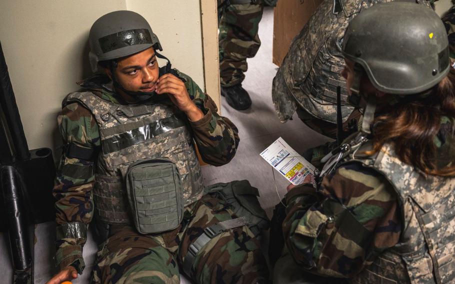 Senior Airman Mark Futch, 8th Comptroller Squadron financial operations technician, left, gets treated by SrA Hailey Koester, 8th Operational Medical Readiness Squadron flight medicine medic, during Ulchi Freedom Shield 24 at Kunsan Air Base, Republic of Korea, Aug. 22, 2024.