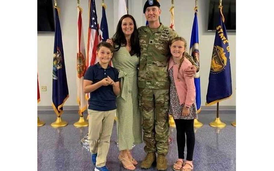 Lt. Col. Justin Darnell, commander, Army Field Support Battalion-Korea, poses with his family following his assumption of command ceremony at Camp Humphreys, South Korea, July 8, 2022. (Courtesy photo)