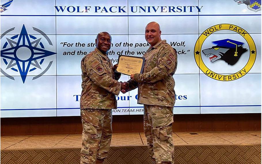 Technical Sgt. Zachary Sweigart, 8th Maintenance Squadron resource advisor, receives a Wolf Pack University certificate at Kunsan Air Base, Republic of Korea. Sweigart received his ‘Warrior’ certificate while acting as an advisor for WPU. (Courtesy photo)