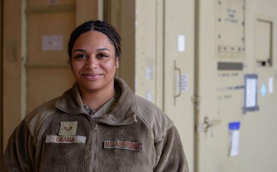 U.S. Air Force Staff Sgt. Kieara Obama, 51st Fighter Wing advanced programs office logistics manager, poses for a photo in front of a deployable debrief facility at Osan Air Base, Republic of Korea.