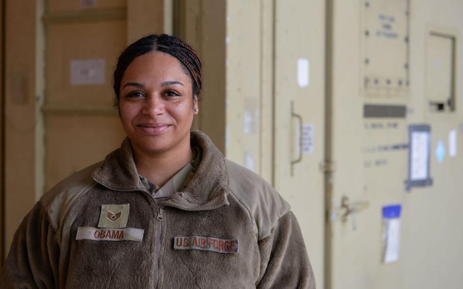 U.S. Air Force Staff Sgt. Kieara Obama, 51st Fighter Wing advanced programs office logistics manager, poses for a photo in front of a deployable debrief facility.