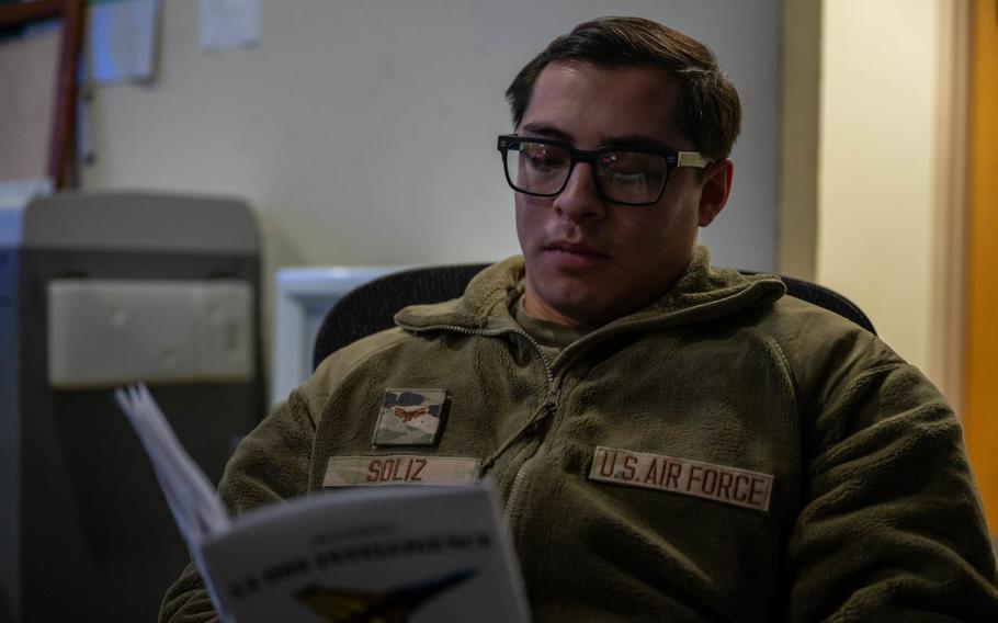 U.S. Air Force Senior Airman Cristian Soliz, 35th Operations Support Squadron Intelligence Formal Training Unit student, reviews an aircraft visual recognition study guide at Osan Air Base, Republic of Korea.