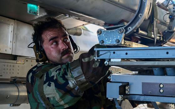 U.S. Air Force Staff Sgt. Jaime Tejada, 35th Fighter Generation Squadron weapons load crew team chief, loads a munition on an F-16 Fighting Falcon aircraft during an integrated combat turn at Kunsan Air Base.