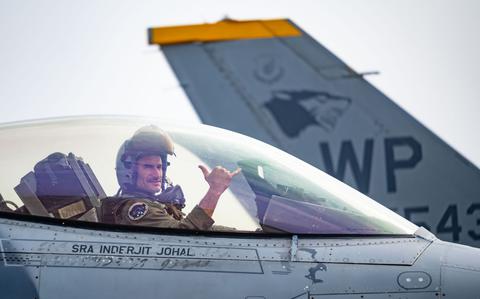 Photo Of Maj. Rex Anderson, 8th Fighter Wing weapons officer, performs a gesture of squadron pride before departing for a routine flight in preparation for Cope Tiger 24 at Korat Royal Thai Air Force Base, Thailand, March 11, 2024.