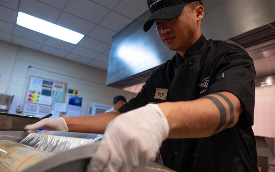 Staff Sgt. Huy Huynh, 8th Force Support Squadron food service accountant, wraps food for lunch service at Kunsan Air Base, Republic of Korea Feb. 8, 2024. In his role as the food service accountant for both dining facilities administration centers on Kunsan AB, he is in charge of the largest customer base in Pacific Air Forces supporting 300,000 customers annually.