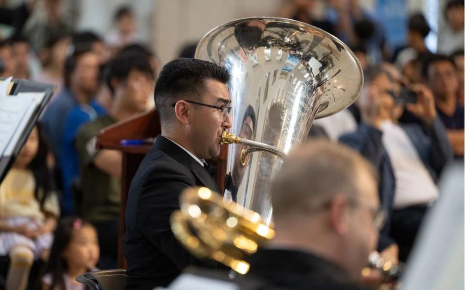 Musician 1st Class John Mangonon, from Elk Grove, California, performs with the U.S. Navy Concert Band at the War Memorial of Korea in Seoul. In addition to hundreds of locals, the event was attended by distinguished guests Philip Goldberg, U.S. Ambassador of Korea, Paik Seung-ju, Chairman of the War Memorial Association, and Rear Admiral Neil Koprowski, U.S. Naval Forces Korea.