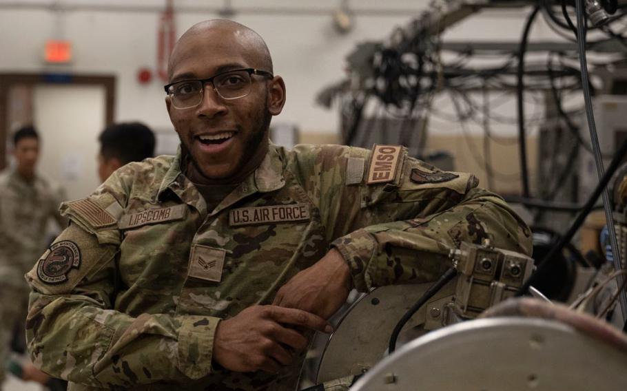 Senior Airman Myles Lipscomb, 8th Maintenance Squadron electromagnetic systems journeyman, stands with an ALQ-184 electronic countermeasure pod assembly at Kunsan Air Base, Republic of Korea, August 5, 2024.