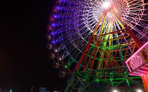 illuminated ferris wheel at night. 